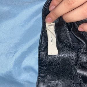 Form fitting leather skirt with buttons